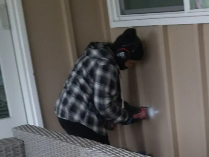 Professional electrician installing an exterior outlet in Cascade